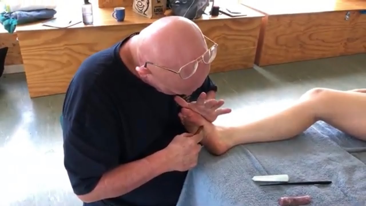 Foot reflexology. Foot massage with Thai massage tools. Raynor massage on Teresa part 2