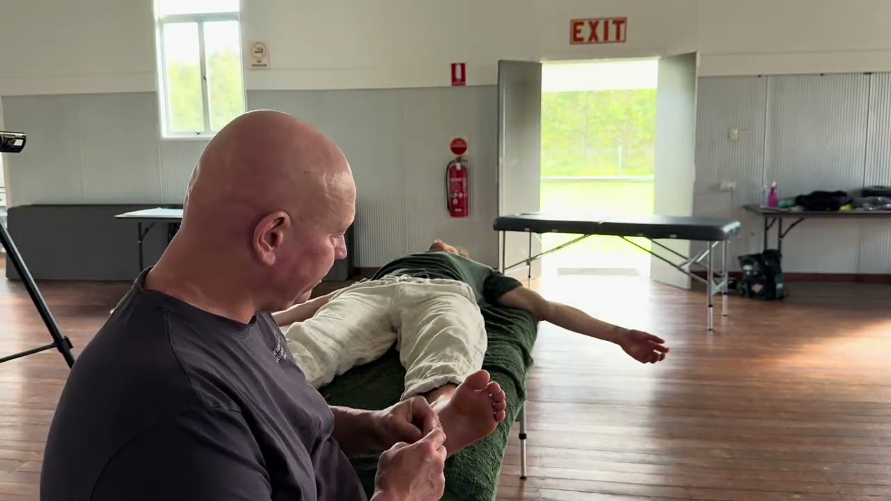 Strong foot massage leading to energy and emotional release. Brandon massaging Spencer part 1.